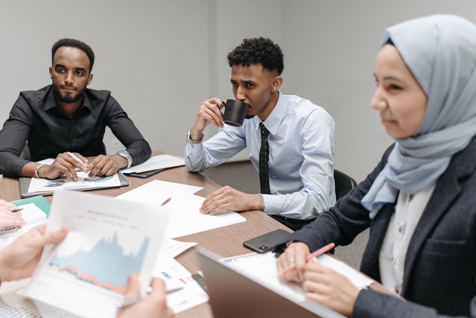 Professionals collaborating in business meeting